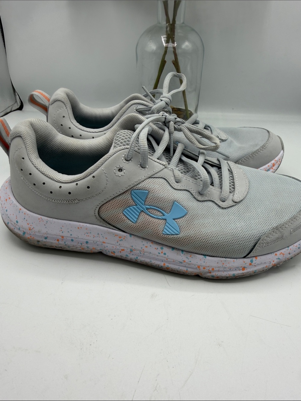 Under Armour Light Gray Sneakers with Blue Logo and Speckled Sole
